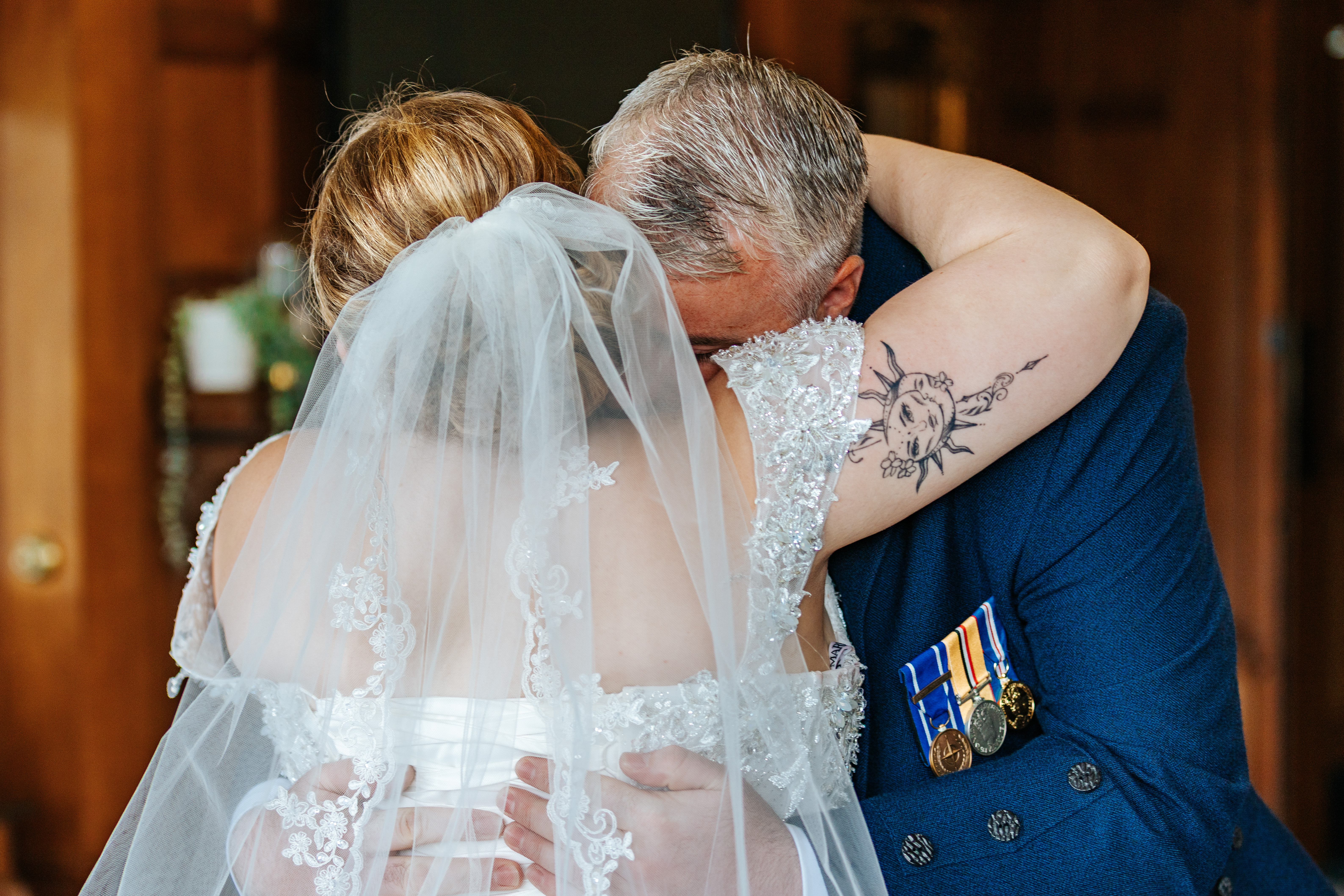 Bride & father hugging